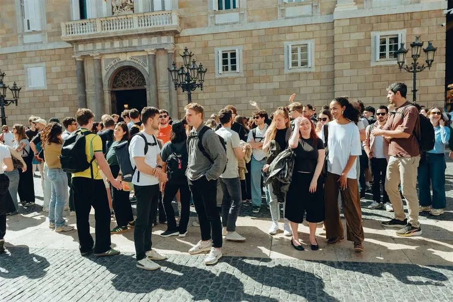 A crowd beneath the Gothic Bishop's Bridge