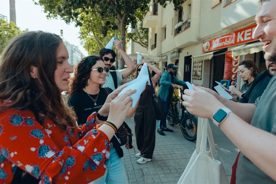 A participant laughing while pointing out a clue