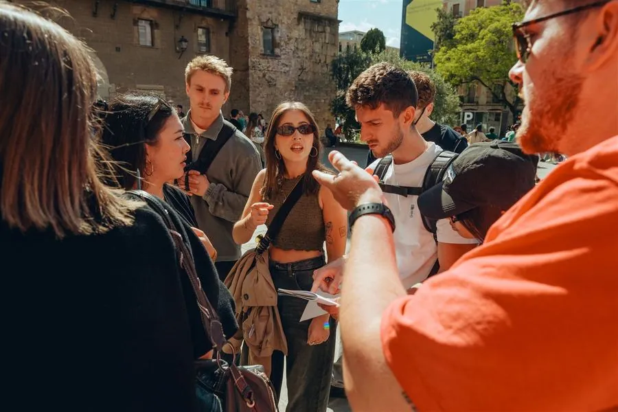 A team huddled together, intensely working out a clue